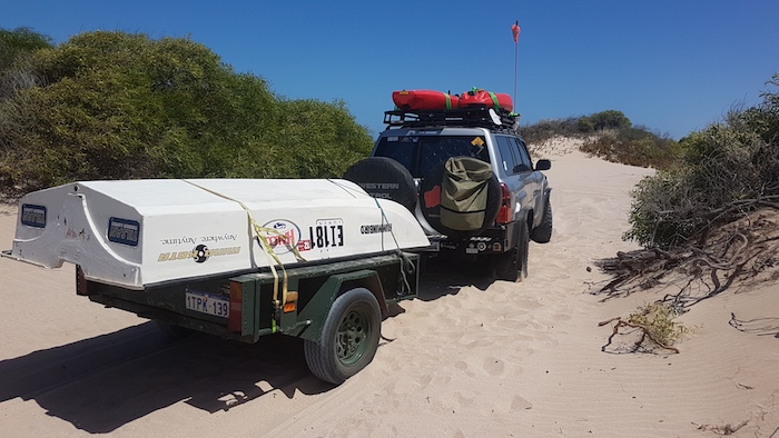 Towing the trailer through the dunes to the beach.
