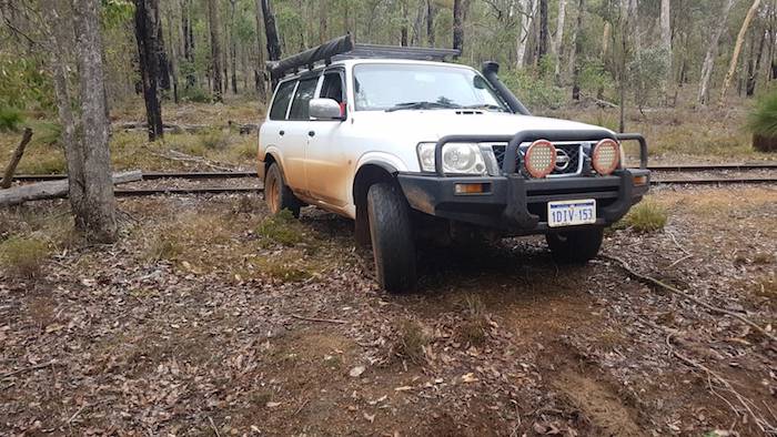 Mike drive his Patrol to the side track.