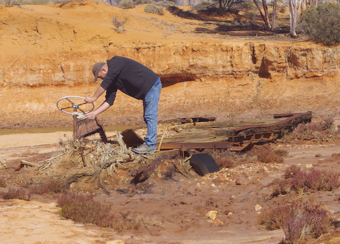 James checks out a wrecked truck in Ponton Creek.