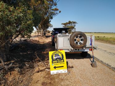 Paul and Kim put out signs to guide the crew to the farm.