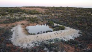 Wallangie Dam with Ives Rock in the background.