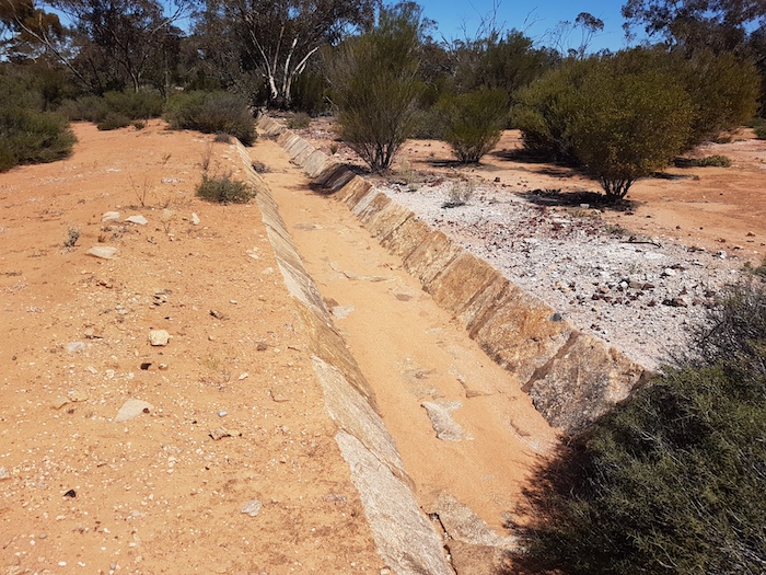 Water harvesting channel direct water from the rock into the dam.