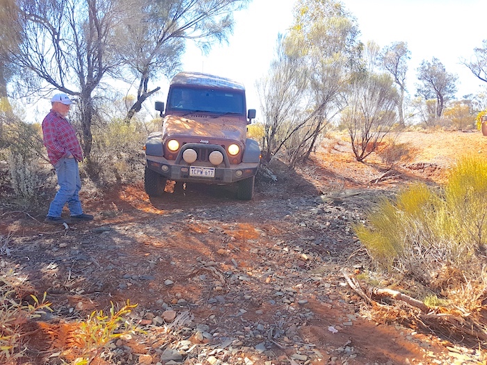 James takes his Jeep through the creek.
