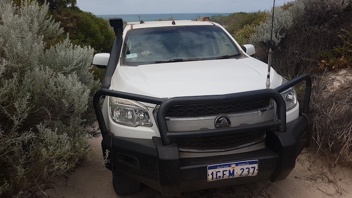 Greg drives his Colorado up the same slope after a bit of track repair.