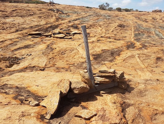 The fence covered an extensive portion of the rock.