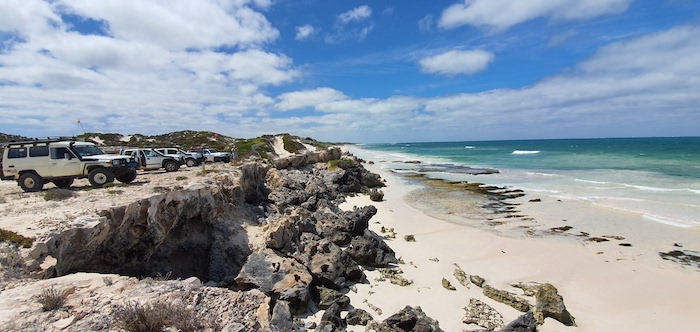 Vehicle lineup on rocks south of Grey.