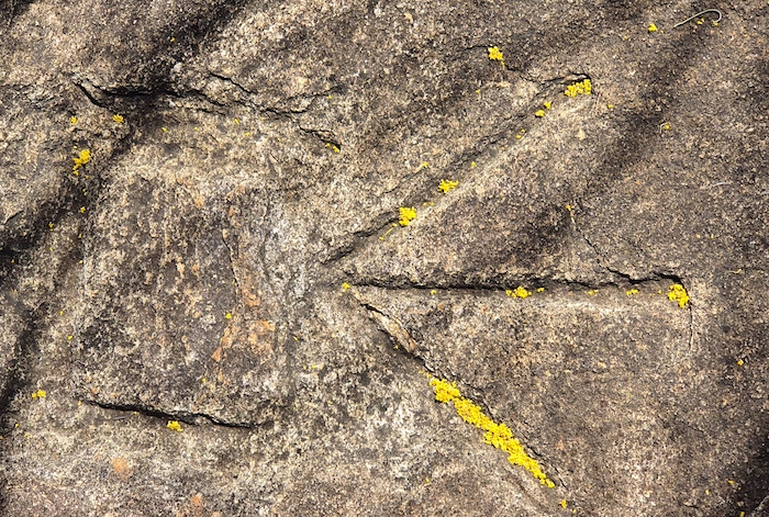 Symbol of the government Public Works Department etched into the rock at Woolgangie.