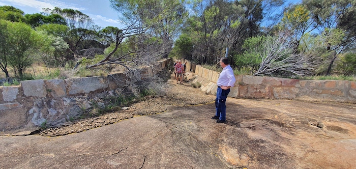 Water is diverted from the rock intp the channel and then to the reservoir.