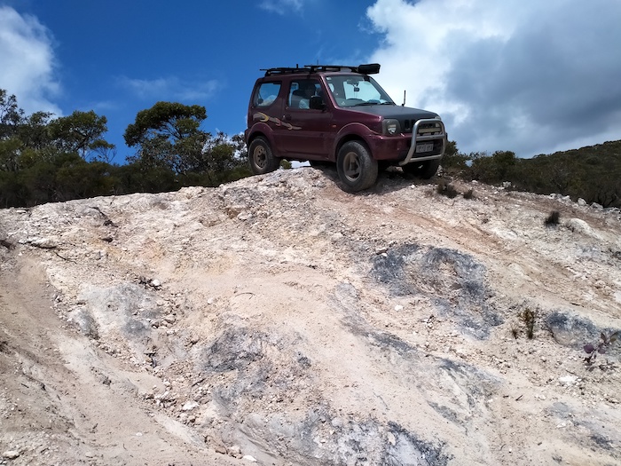 Adi in his Jimny at the dropoff.